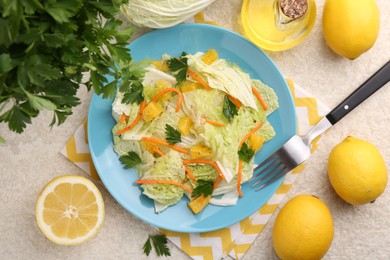 Photo of Tasty salad with Chinese cabbage, products and fork on beige table, flat lay