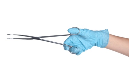 Photo of Doctor in sterile glove holding medical forceps on white background