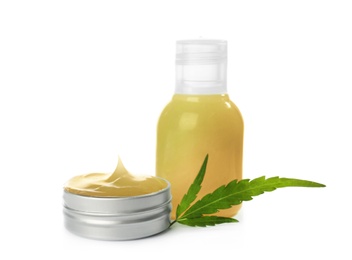 Bottle and jar with hemp lotion on white background