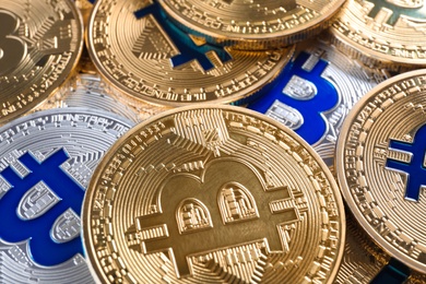Photo of Shiny bitcoins as background, closeup view. Digital currency