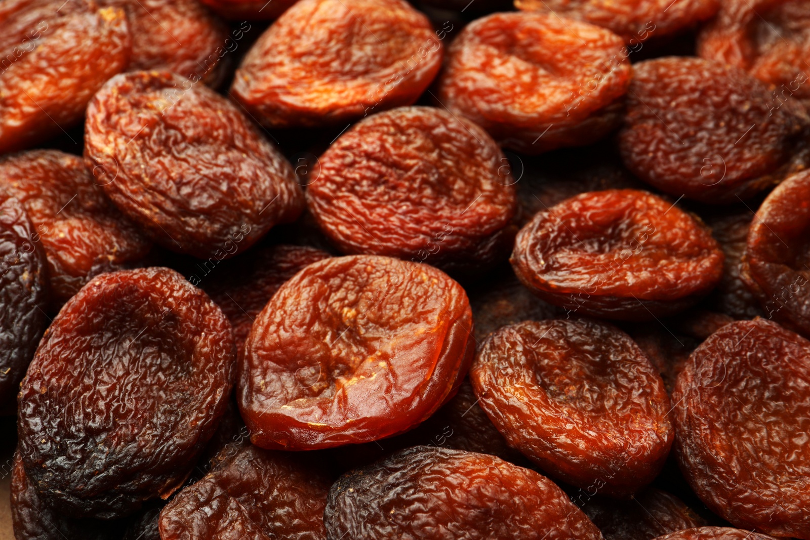 Photo of Tasty dried apricots as background, closeup. Healthy snack