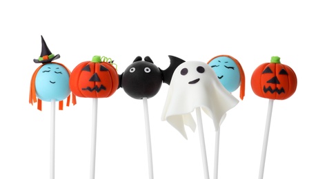 Photo of Different Halloween themed cake pops on white background