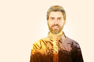 Image of Double exposure of handsome man and plants in field at sunset