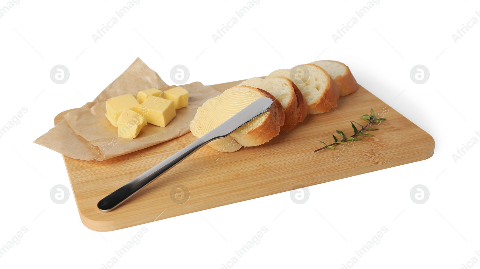 Photo of Wooden board with sliced baguette and fresh butter on white background