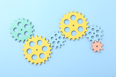 Business process organization and optimization. Scheme with colorful figures on light blue background, top view