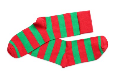 Pair of striped socks on white background, top view