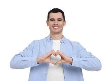 Photo of Man showing heart gesture with hands on white background