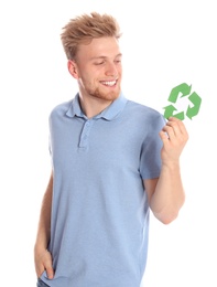 Young man with recycling symbol on white background