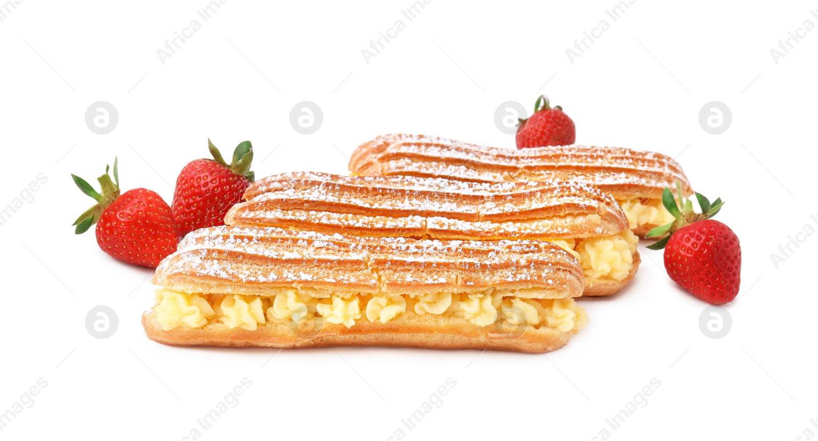 Photo of Delicious eclairs filled with cream and strawberries isolated on white