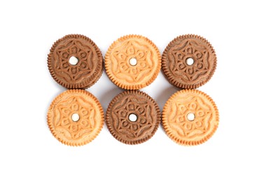 Photo of Different tasty sandwich cookies on white background, top view