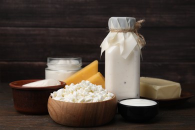 Photo of Different fresh dairy products on wooden table