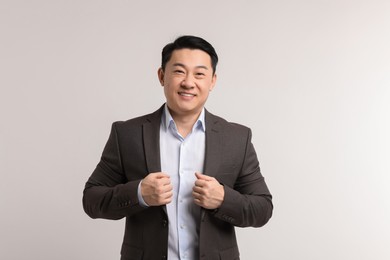 Portrait of happy man on light background