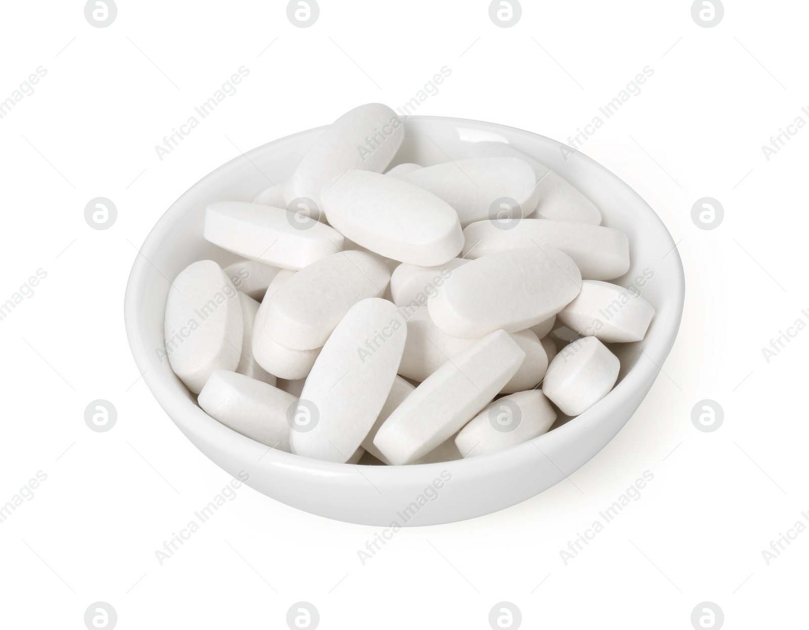 Photo of Vitamin pills in bowl isolated on white. Health supplement