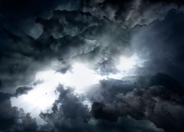 Image of Beautiful view of sky covered with grey thunderclouds