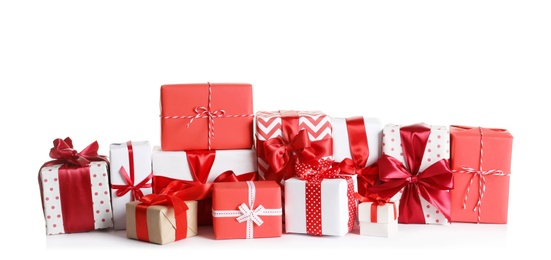 Photo of Beautifully wrapped gift boxes on white background