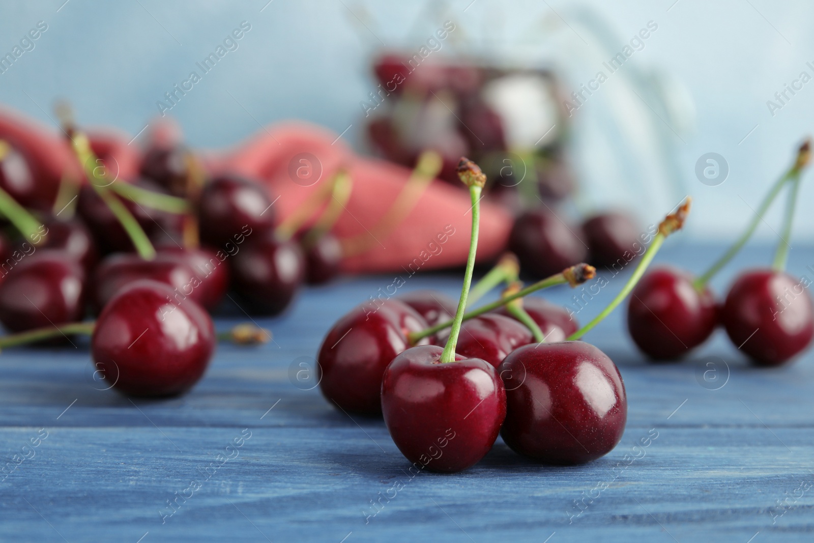 Photo of Sweet red cherries on wooden table