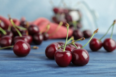 Sweet red cherries on wooden table