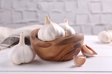 Fresh garlic on white wooden table, closeup