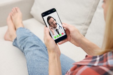 Image of Online medical consultation. Woman having video chat with doctor via smartphone at home, closeup