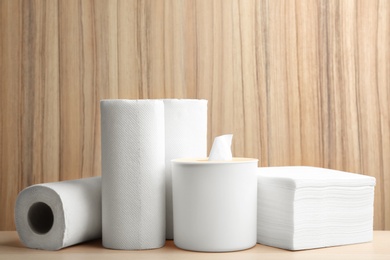 Photo of White clean paper tissues on wooden table