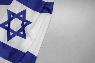 Photo of Flag of Israel on grey textured background, top view and space for text. National symbol