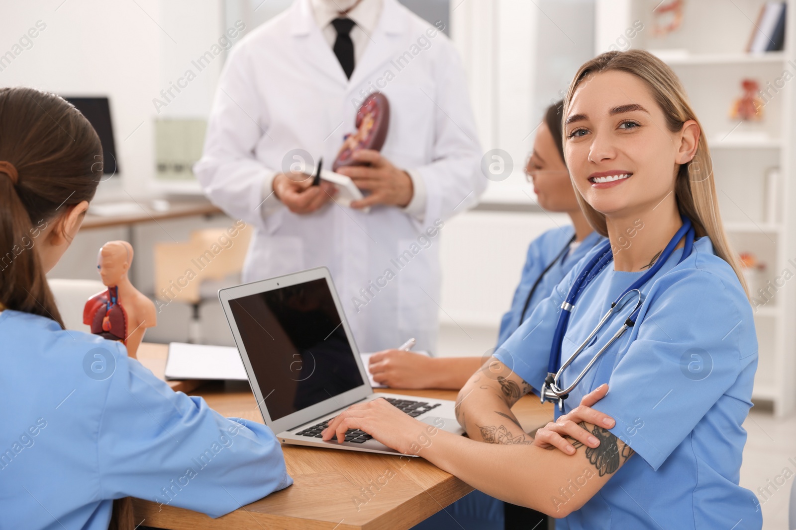 Photo of Portrait of young intern wearing uniform on lecture in university