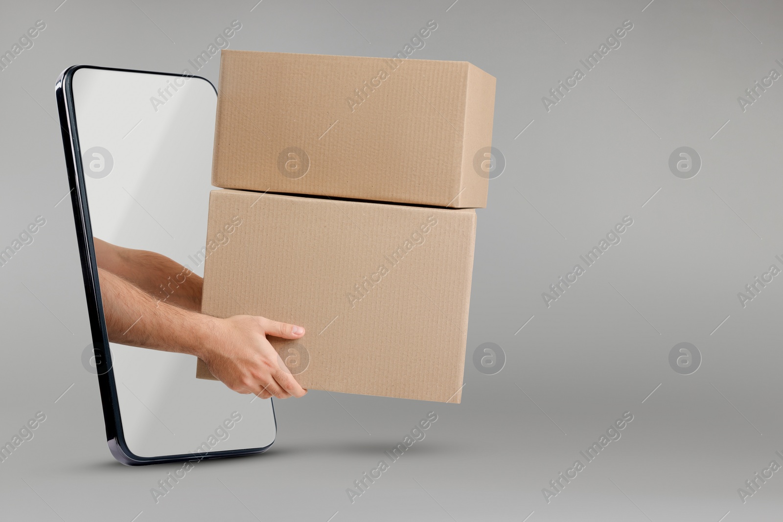 Image of Courier passing parcels through smartphone on grey background. Delivery service