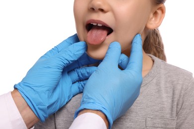 Photo of Doctor examining girl`s oral cavity on white background, closeup