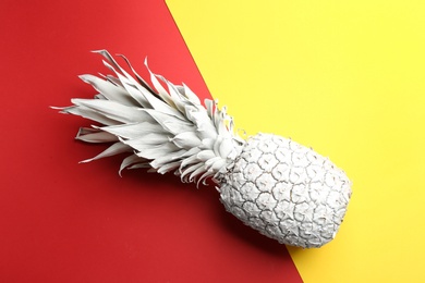 White pineapple on color background, top view. Creative concept