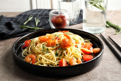 Delicious pasta with shrimps on plate