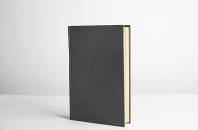 Photo of Hardcover book on white background. Space for design