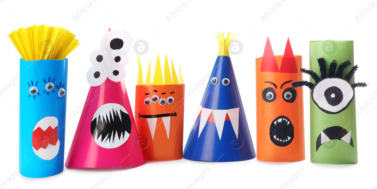 Photo of Funny monsters on white background. Halloween decoration