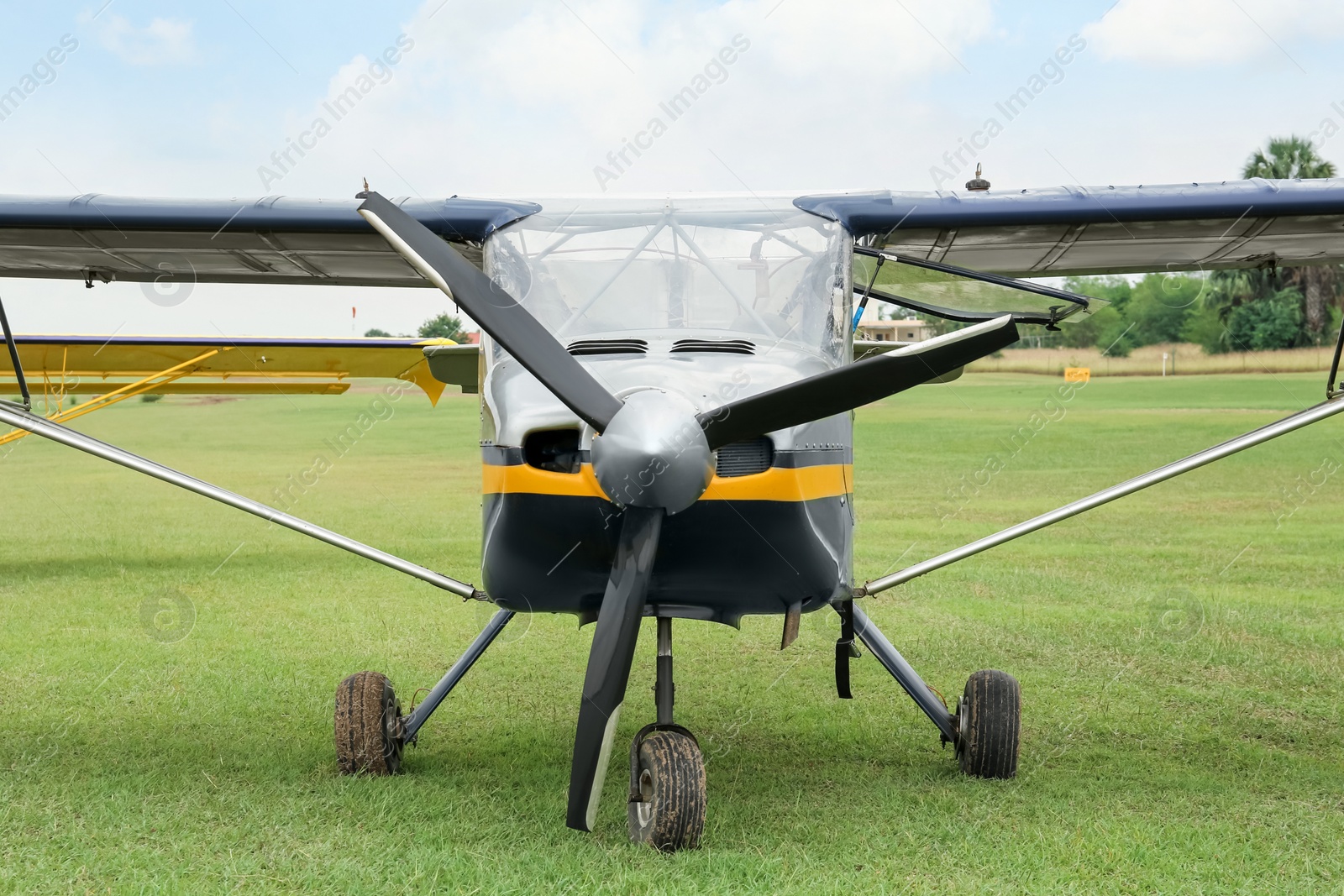 Photo of View of beautiful ultralight airplane in field on autumn day