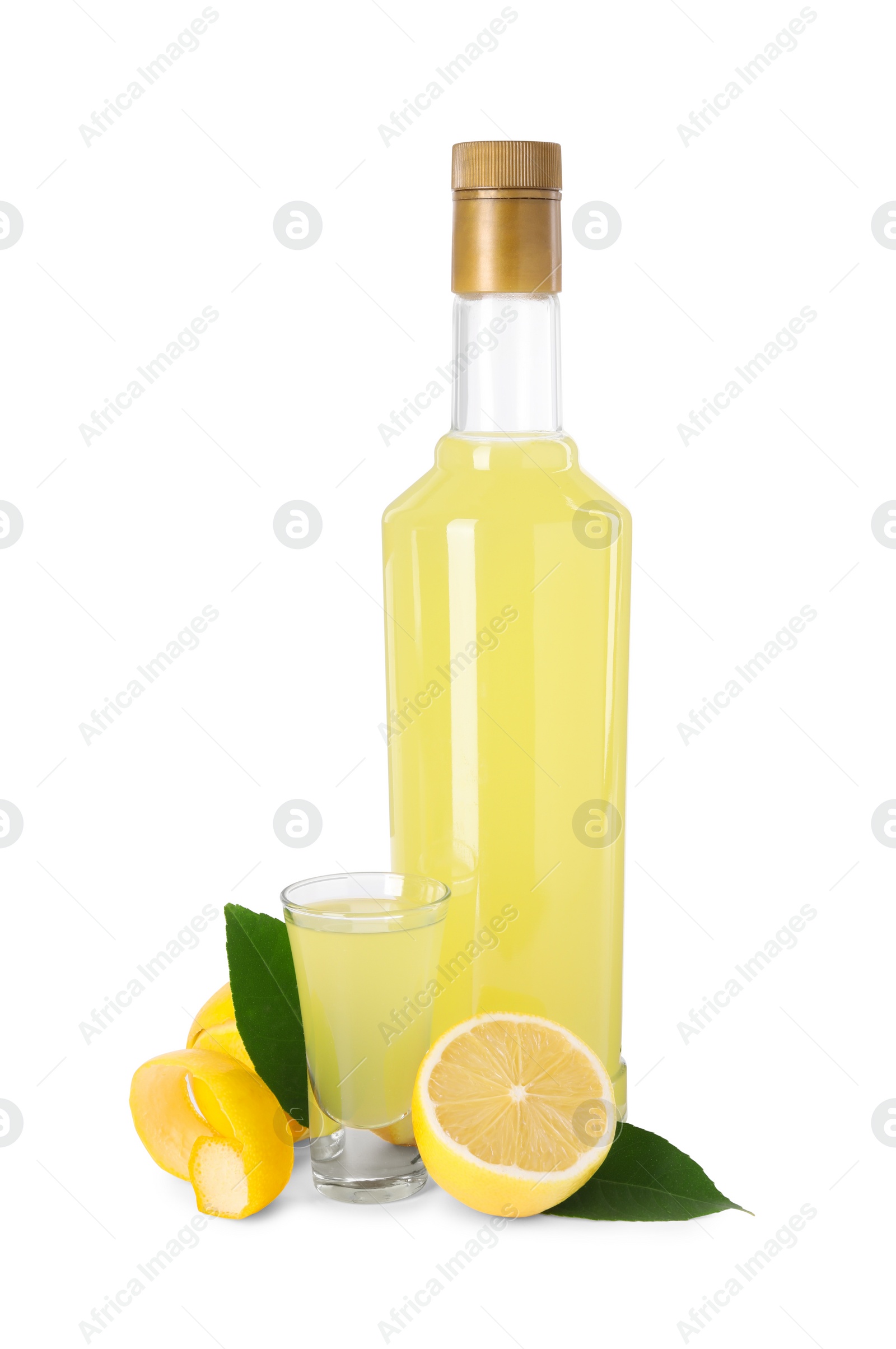 Photo of Tasty limoncello liqueur, lemons and green leaves isolated on white