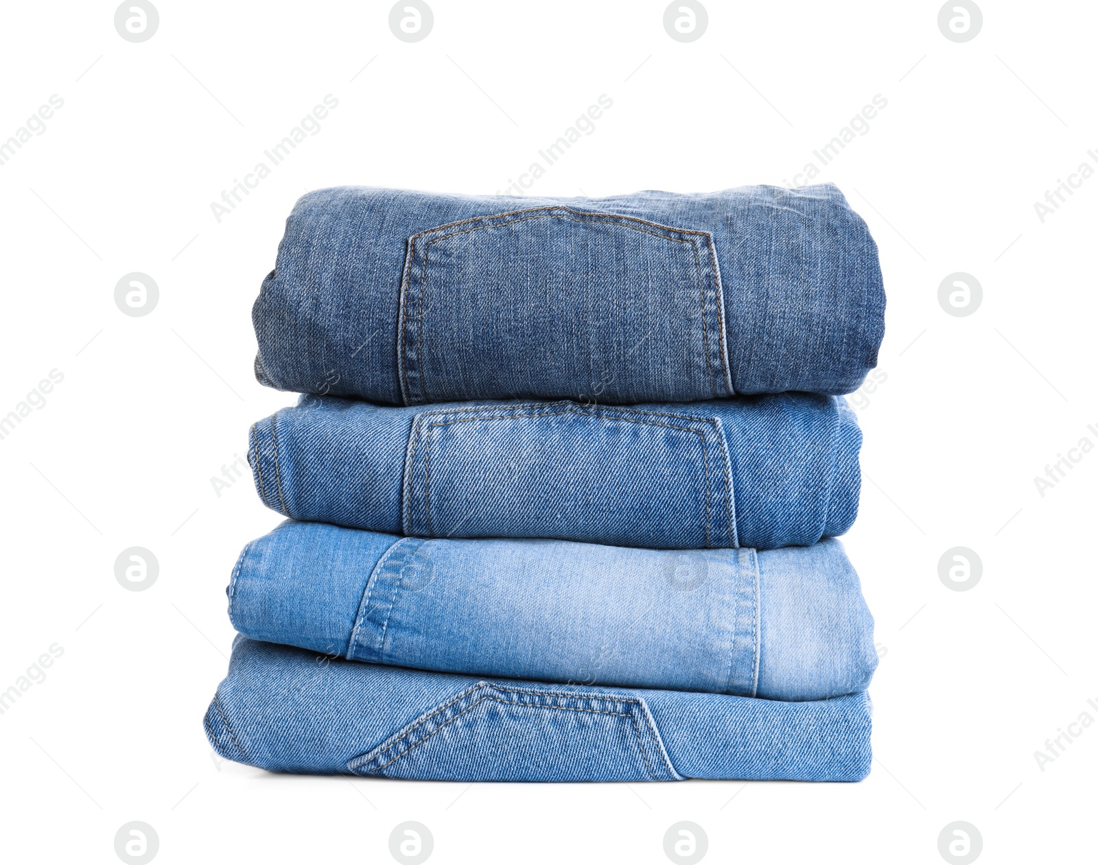 Photo of Stack of different jeans isolated on white