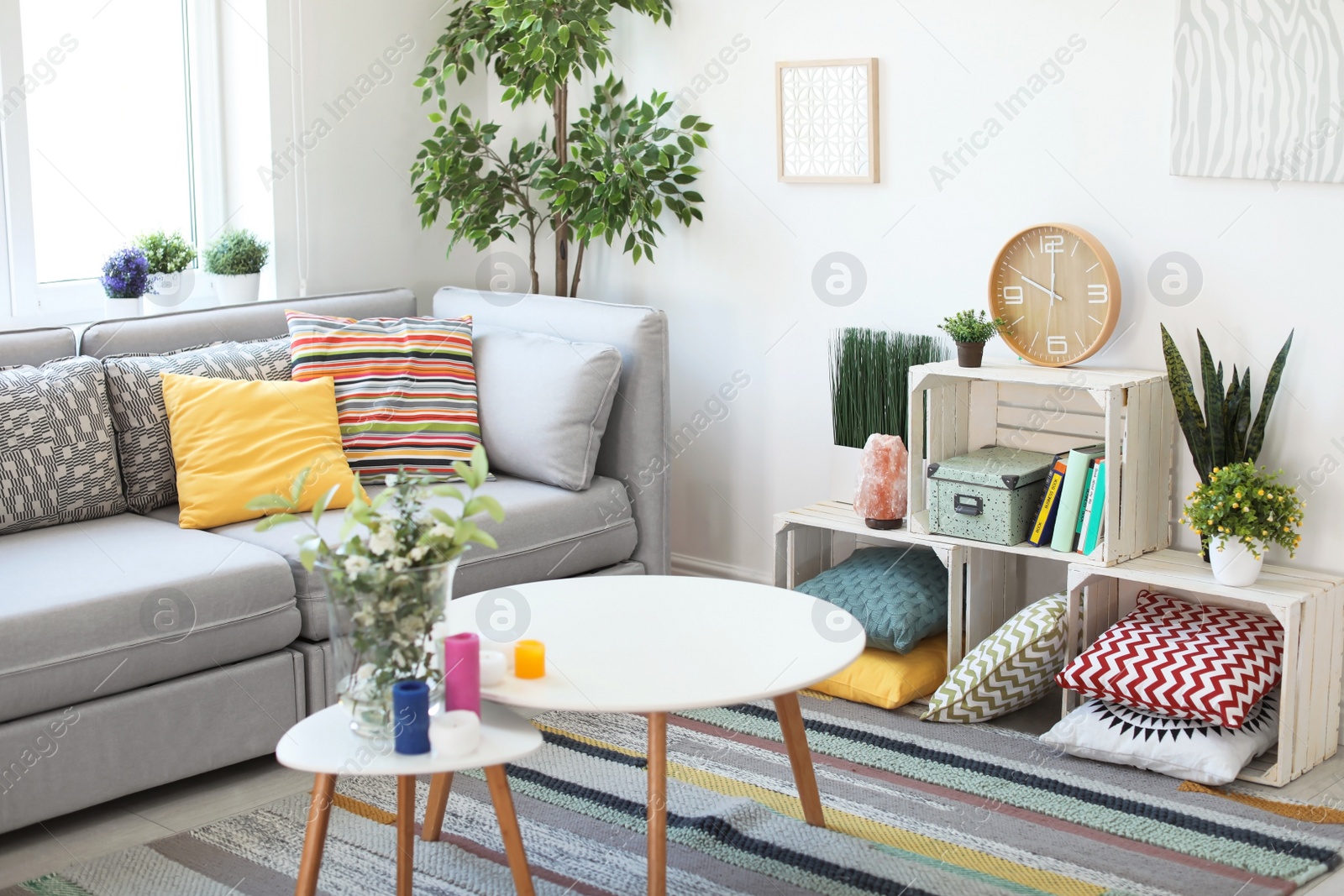 Photo of Interior of modern living room with pillows on sofa