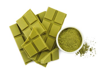 Pieces of tasty matcha chocolate bar and powder isolated on white, top view