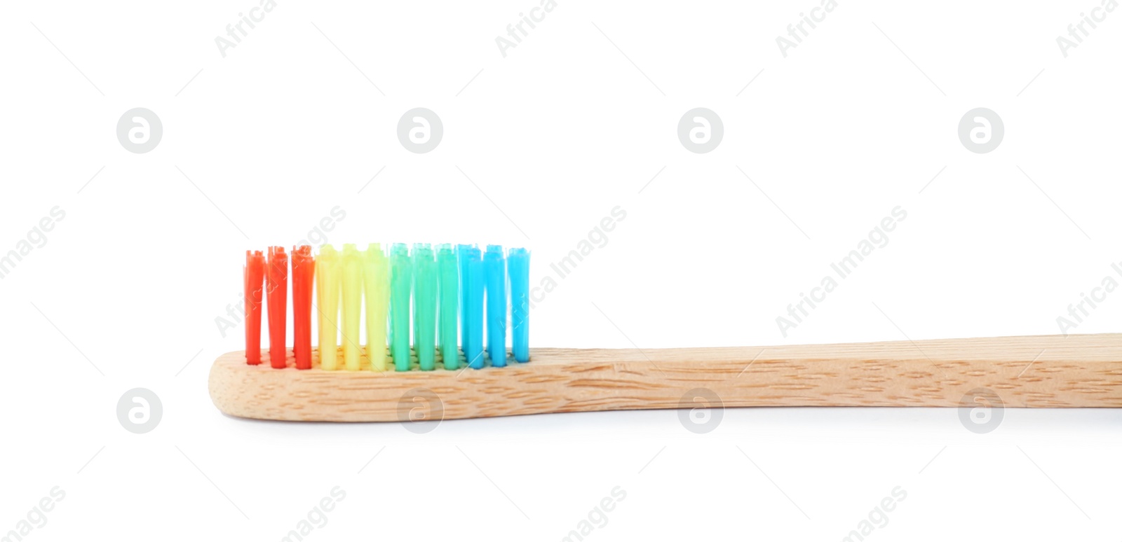 Photo of Bamboo toothbrush on white background. Dental care