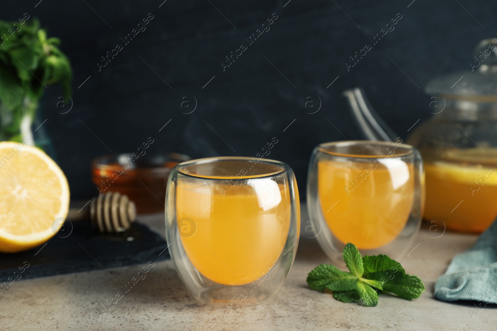 Photo of Immunity boosting drink and ingredients on light grey table