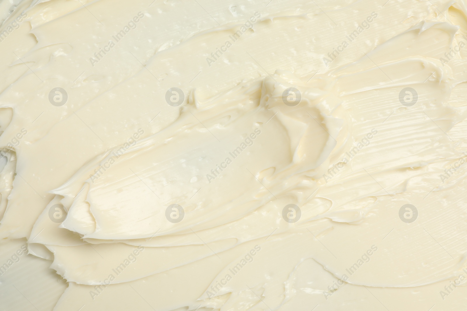 Photo of Texture of tasty butter as background, top view