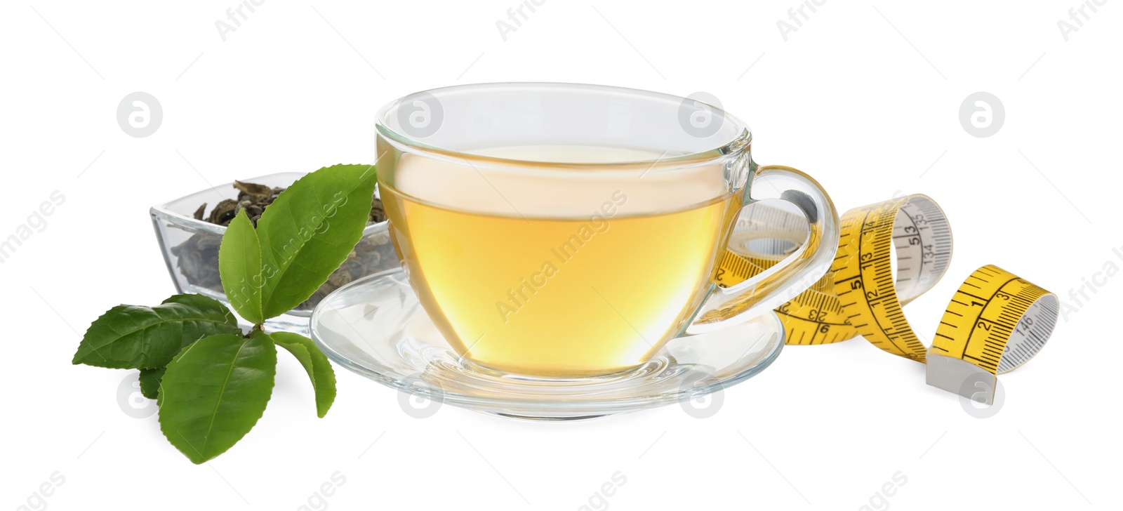 Photo of Diet herbal tea, measuring tape, dry and fresh leaves on white background