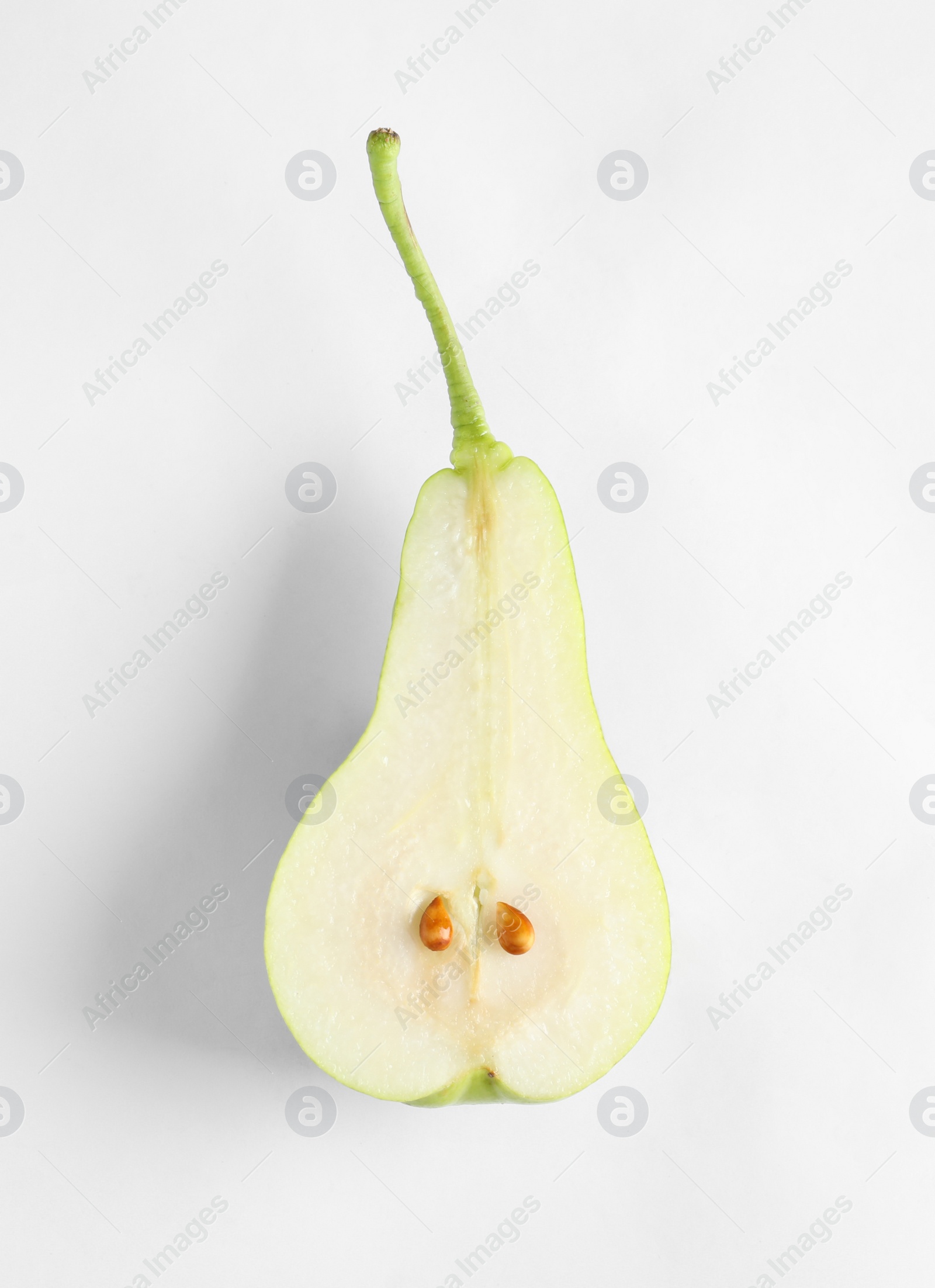 Photo of Half of ripe pear on white background