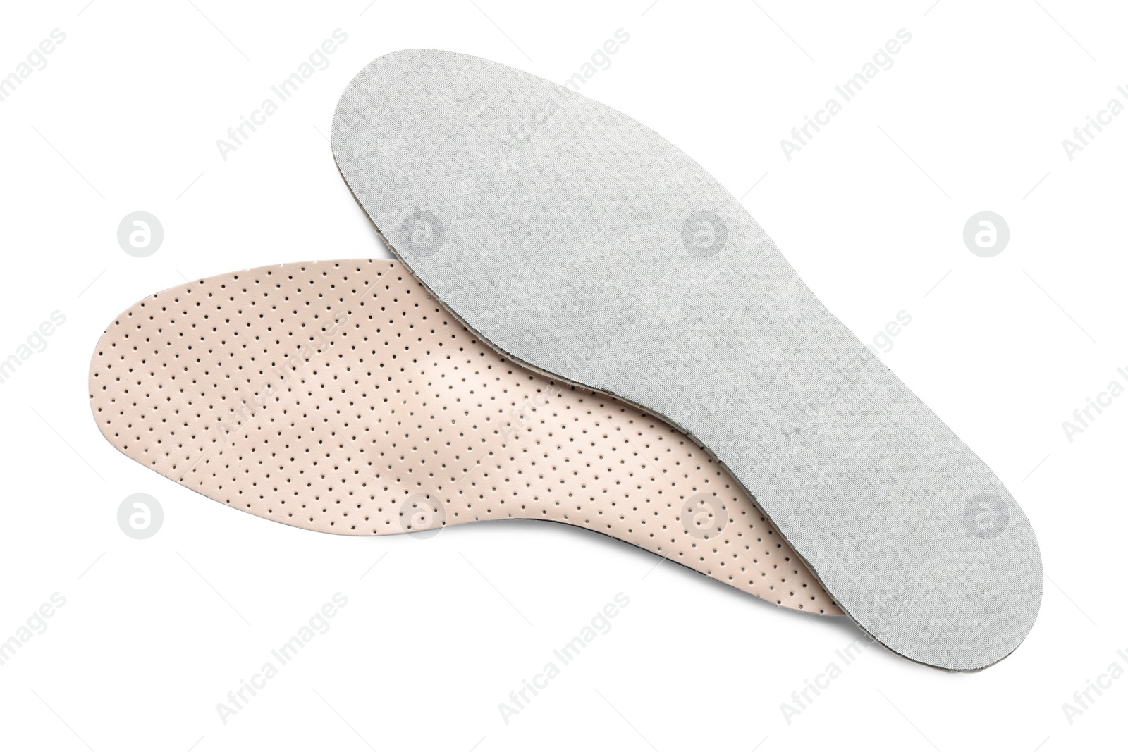 Photo of Beige orthopedic insoles isolated on white, top view