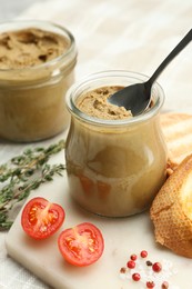 Photo of Tasty liver pate, bread and tomato on white board