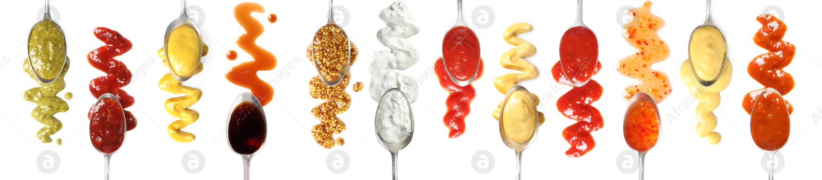 Image of Set of spoons with different delicious sauces on white background, top view. Banner design