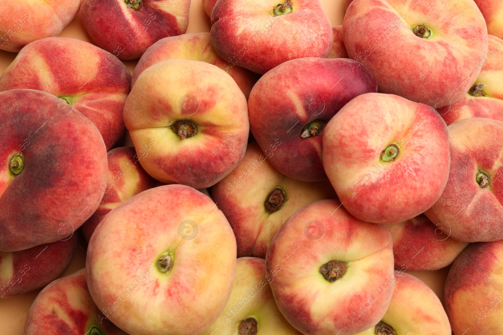 Photo of Heap of fresh donut peaches as background, closeup