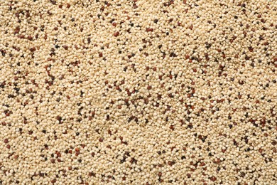 Photo of Raw quinoa seeds as background, top view