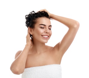 Photo of Beautiful young woman washing hair on white background