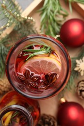 Aromatic punch drink and Christmas decor on table, flat lay