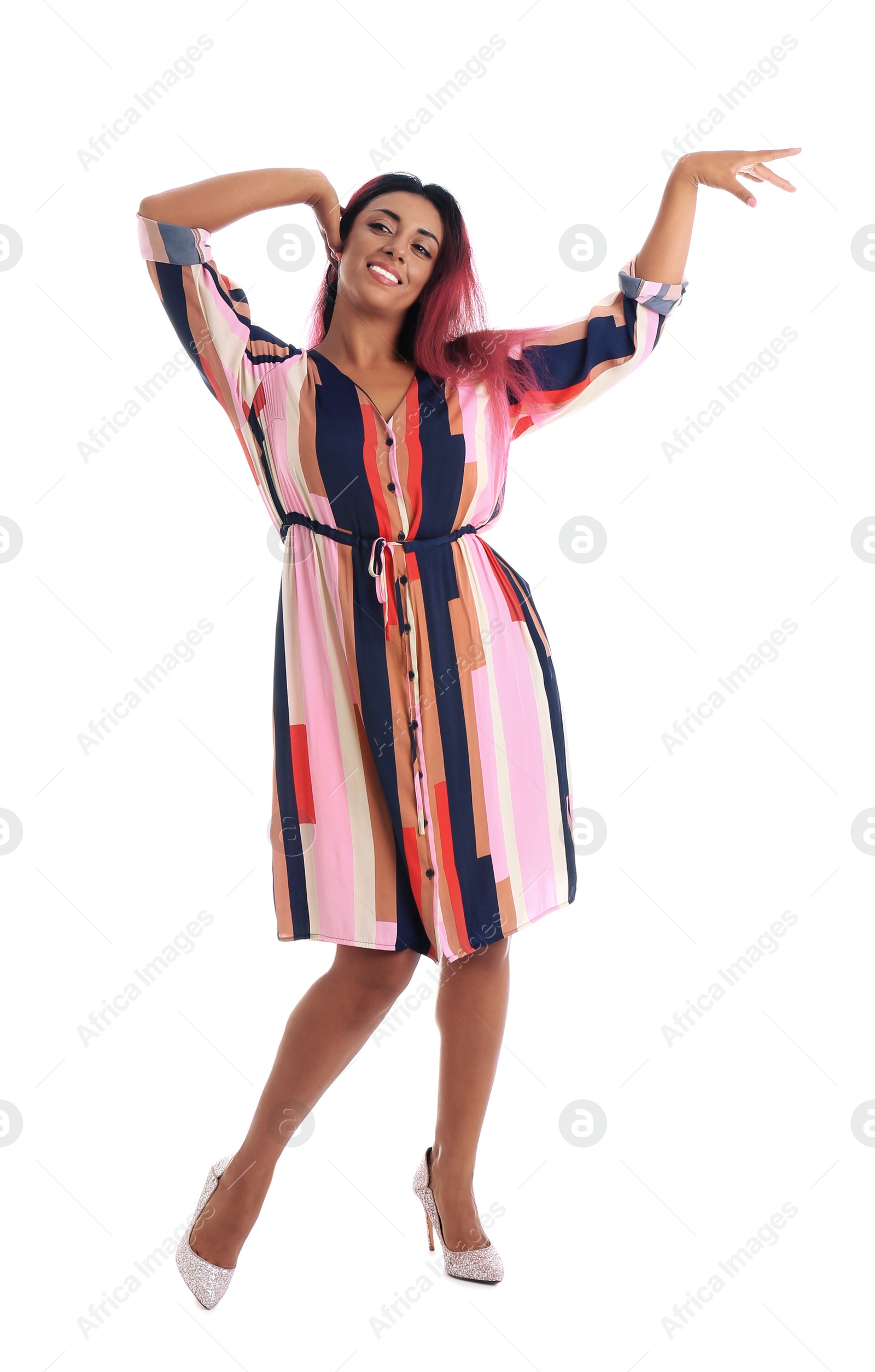 Photo of Beautiful Hispanic woman dancing on white background